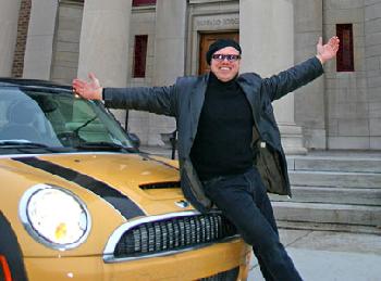 Maxwell Truth (aka tour guide Eddy Dobosiewicz) with his mini-cooper in front of Buffalo's Masonic Lodge, which is now an auction house