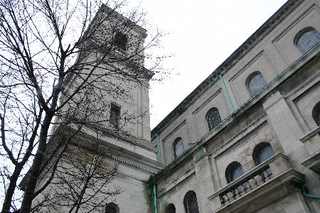 The building, in the Roman Basilica style, is based on the design of St., Paul&#39;s Outside the Walls in Rome, being one-third as large. Constructed of Indiana limestone, the main facade features two niches containing statues of St. Gerard and St. .Joseph. Carved by local sculptor Angelo Gatti, the St. Joseph figure features a miniature of the church at his feet.