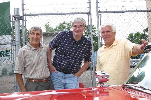 Former KB Jocks Stan Roberts, Tom Donahue and Danny Neaverth stand in-front of the historic 1430 Main Street studios of WKBW Radio.