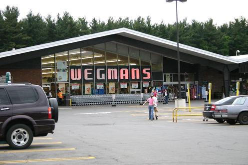 The Wegmans Fairport Road store can be classified as an example of mid-century modern architecture. They style is usually defined as buildings constructed between the mid-1950s through the late 1960s. Typical mid-century architecture features include abstract shapes and curves, innovative use of materials, and a sense of humor and optimism. People also refer to this period as "googie", "jetset", "space age", "Jetsons", "populuxe", etc.